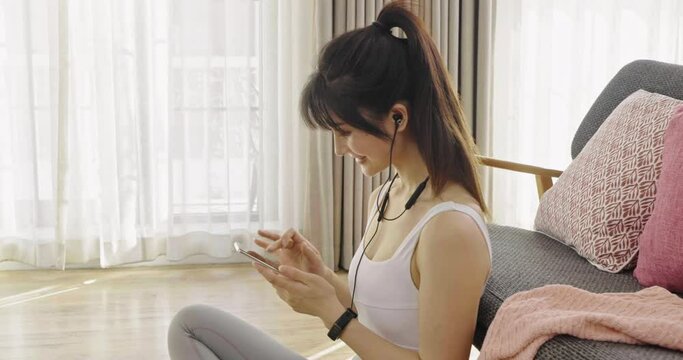 Young woman listening to music after exercising,4K