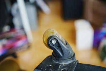 an old dirty broken wheel from a black travel suitcase. 