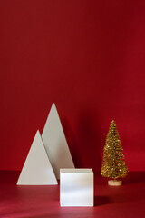 White Podiums or Pedestals and Golden Small Christmas Tree for Christmas Product Display on Red...
