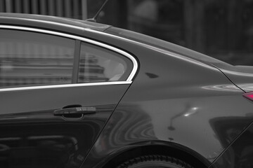 Black opel insignia view of back door parked in a city road