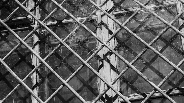 windows with bars with flashing white scratches