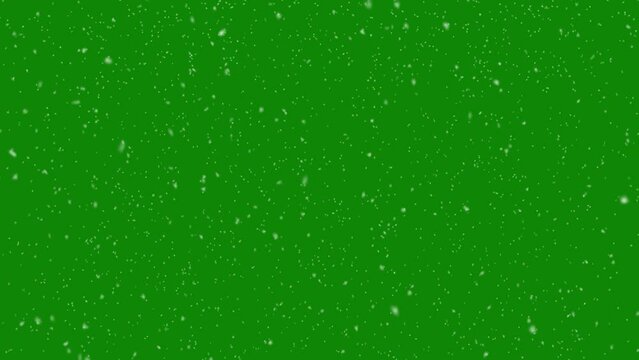 Snowfall overlay on green background. Winter slowly falling snow effect. Chroma key background