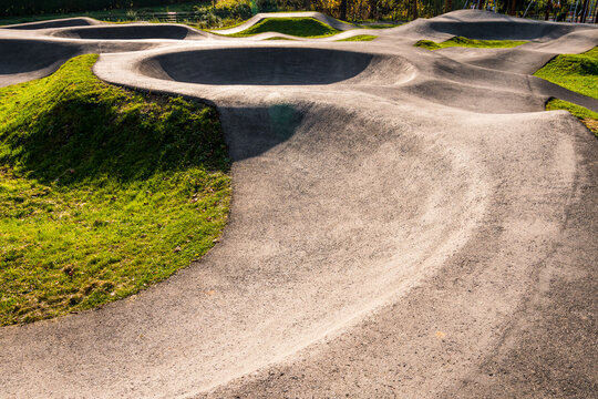 Outdoor bicycle asphalt pumptrack surrounded by nature in Polanka Wielka, Poland.