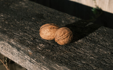 walnut on the wooden bench, closeup