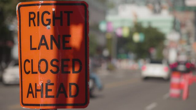 Right lane closed ahead due to construction traffic sign, 