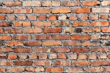 Old rough red brick wall, background texture