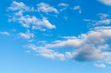 Naklejka na ściany i meble Blue sky with white clouds. Natural background photo