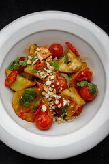 Marinated eggplants with tomatoes, nuts and spices