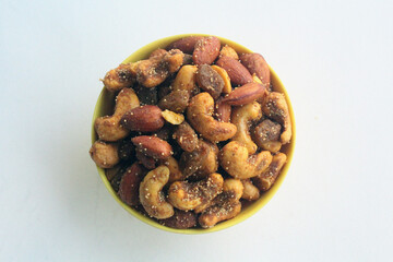 Delicious Healthy dry fruits salted masala cashew close up in the plain  bowl