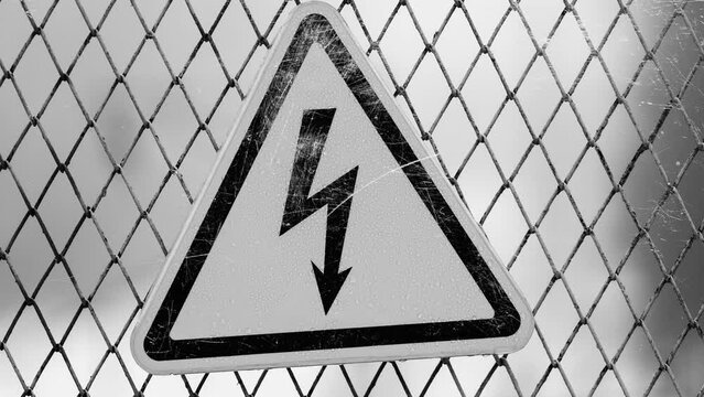 triangular electricity sign with flashing white scratches