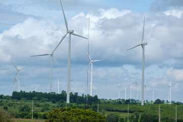 Tall windmills in the middle of nature in Thailand