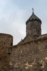 Fototapeta premium Armenia, Tatev, September 2022. Fortress wall and church tower.