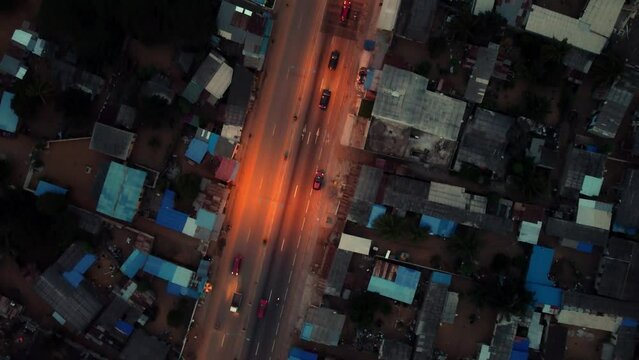 Cinematic 4K Top Down Aerial Drone Shot of Road Traffic At Night with Cars Driving During Rush Hour in African City - Lom&eacute;, Africa