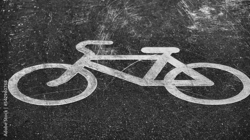Poster white drawing of a bicycle on the pavement with flashing white scratches