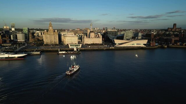 Aerial view of The Mersey Ferry boat arrives at the Liverpool waterfront called the Pier Head, Merseyside, England