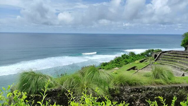 Ocean viewed from Gunung Payung Temple, Badung Regency, Bali, Indonesia. Beautiful waves on the beach.