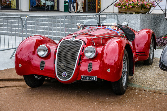 BADEN BADEN, GERMANY - JULY 2019: red ALFA ROMEO 8C 2900B TOURING SPIDER 1937 cabrio roadster, oldtimer meeting in Kurpark