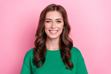 Fototapeta premium Photo of fancy gorgeous satisfied nice woman with wavy hairdo dressed green t-shirt blinking winking isolated on pink color background