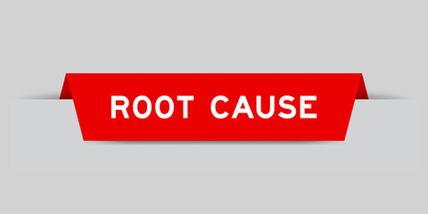 Red color inserted label with word root cause on gray background