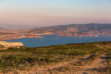 Mountains against the backdrop of a pink sunset, reservoir, in the Sulak canyon, Dagestan.