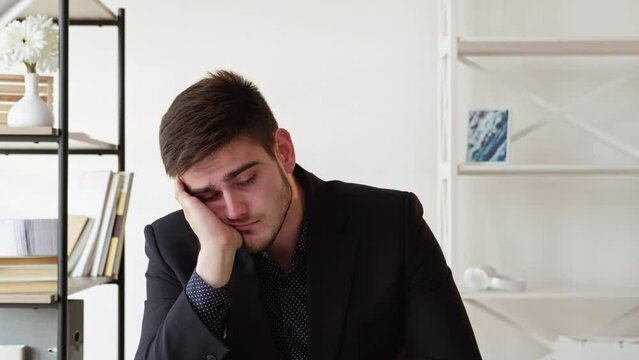 Disappointing meeting. Virtual call. Interview failure. Dissatisfied tired skeptic business man listening boring negotiation in virtual office. Long video shot.