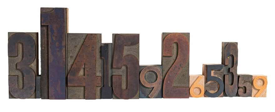 Isolated wooden letterpress block type of various sizes spelling out the expanded digit number pi 3.14