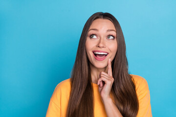 Fototapeta premium Closeup photo of young pretty cute nice woman look interested touch cheeks nice sale shopping deal isolated on blue color background