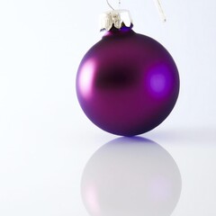 Purple Christmas bauble tree decoration with silver top isolated on white background with reflection