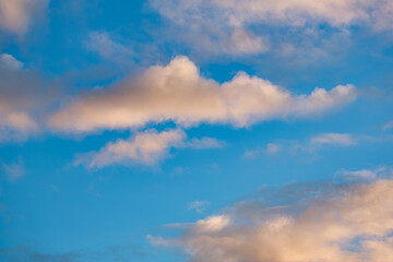 Beautiful blue sky with fluffy clouds at a cold autumn day  
