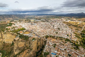 Peel and stick wall murals Ronda Puente Nuevo The drone aerial panoramic view of Ronda, Spain. Ronda is a town in the Spanish province of Málaga.Ronda is known for its cliff-side location.