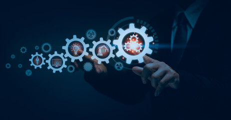 Businessman's hands touching cogwheel icon, technology automation concept, software implementation...
