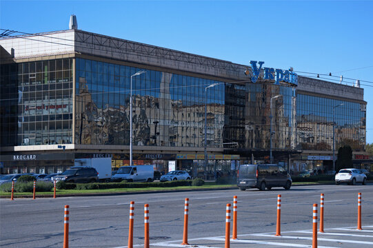 Kyiv, Ukraine-October 08,2022:View of famous shopping mall Ukraine on Victory Square.Text on the facade ???????? (an English Ukraine). Concept of modern architecture from glass, steel and concrete