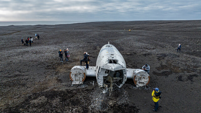 aerial view of damaged dc 3 plane in iceland black beach