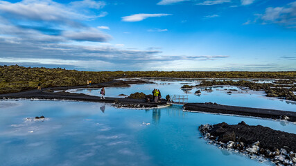 aerial view of blue lagoon in iceland with blue water hot springs