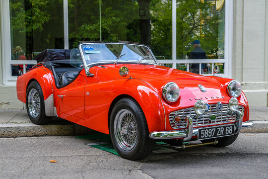 BADEN BADEN, GERMANY - JULY 2019: red TRIUMPH SPORT TR3A TR3 HT cabrio roadster, oldtimer meeting in Kurpark