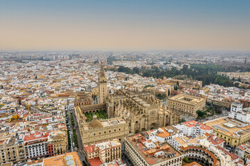 The drone aerial view of Seville Cathedral (Catedral de Santa Maria de la Sede de Sevilla) at...