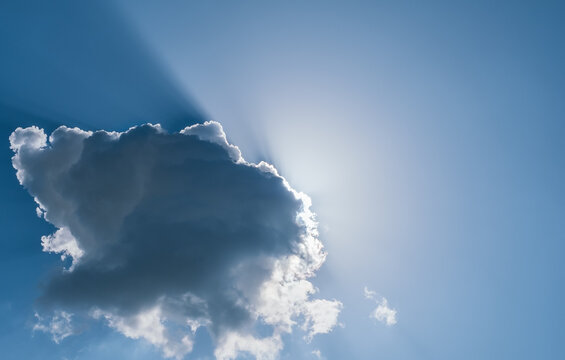 Blue sky and clouds with sunbeams, background or wallpaper idea for weather news