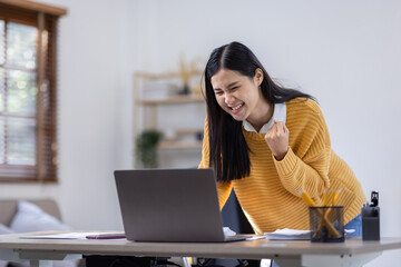Enthusiastic asian woman rejoicing, excited, say yes, individual, looking happy and celebrating...
