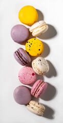 French sweet macaroons on a white background with a shadow. Concept delicious food.