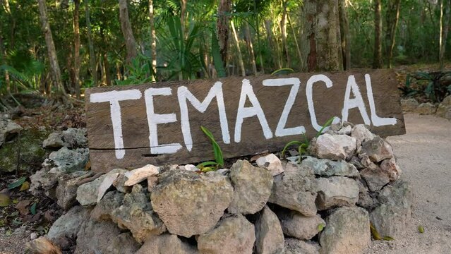 Temazcal board, plaque. Wooden plaque with the inscription Temazcal. The video was shot in the summer of 2021, not far from the city of Cancun in Mexico.