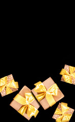 Gift boxes with yellow polka dot ribbons and bows on black. Christmas, Black Friday, Boxing day sale