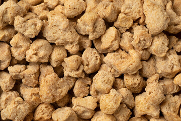 Dried soya chunks close up full frame as background