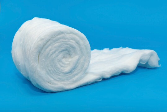 Medical cotton wool on a blue background close-up. cotton ball