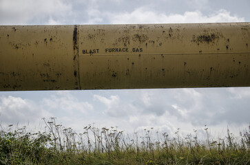 Old gas pipe on derelict site of former steel mill