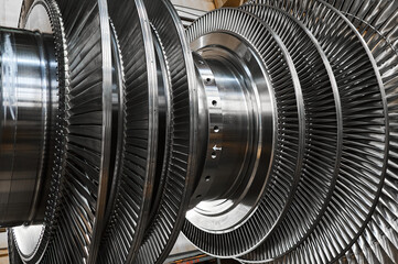 New rotor of powerful steam turbine in plant workshop
