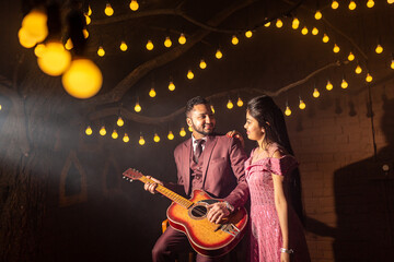A young Indian couple shooting their pre wedding at a famous studio in Delhi India. Romantic couple having shoot Delhi. Best young couple India. Pre wedding Indian couple.
