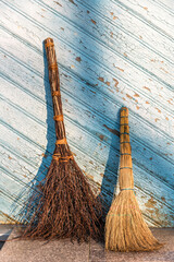 2 old church brooms