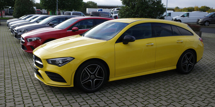 Wietmarschen, Germany Oct 25 2022 A row of used Mercedes-Benz cars at a car seller. The front one in yellow is a Mercedes-Benz CLA 200 Shooting Brake