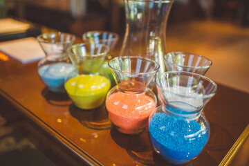 glass jars with colored sand