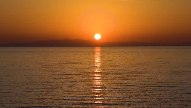 Veduta panoramica al tramonto dei monti calabresi da Campomarino Taranto Puglia